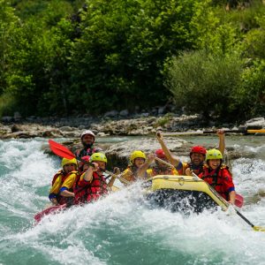 people riding on yellow kayak on river during daytime